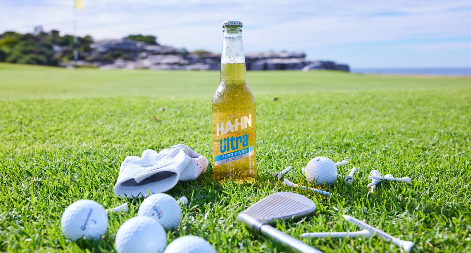 Photo of a bottle of Hahn Ultra on a golf course